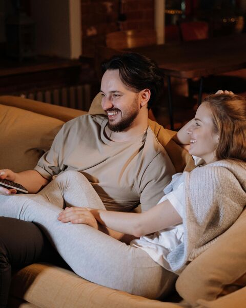 Couple relaxing in cozy living room